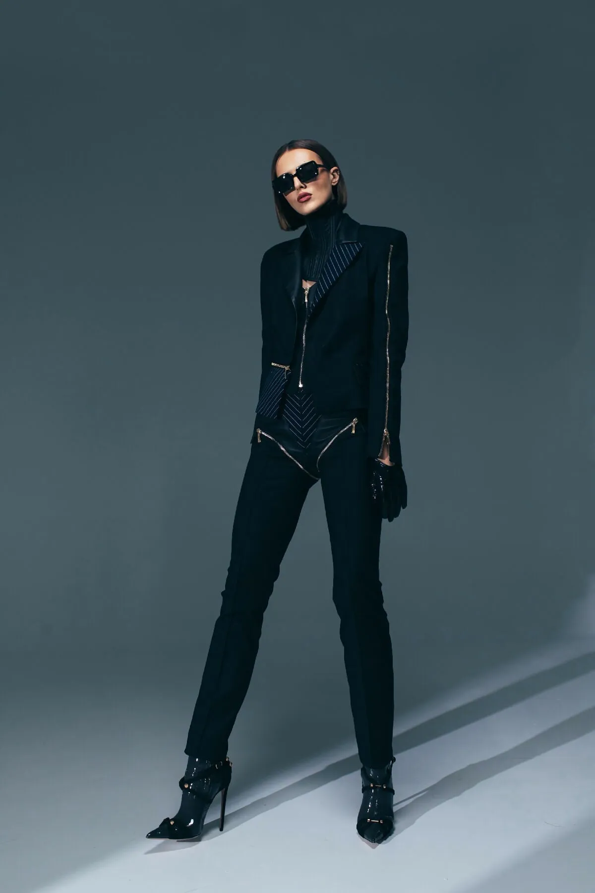 BLACK LEATHER TROUSERS WITH STRIPES AND LEATHER DETAILS